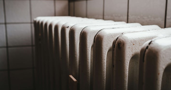 Closeup of an outdated heating unit.