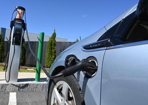 car attached to EV charging